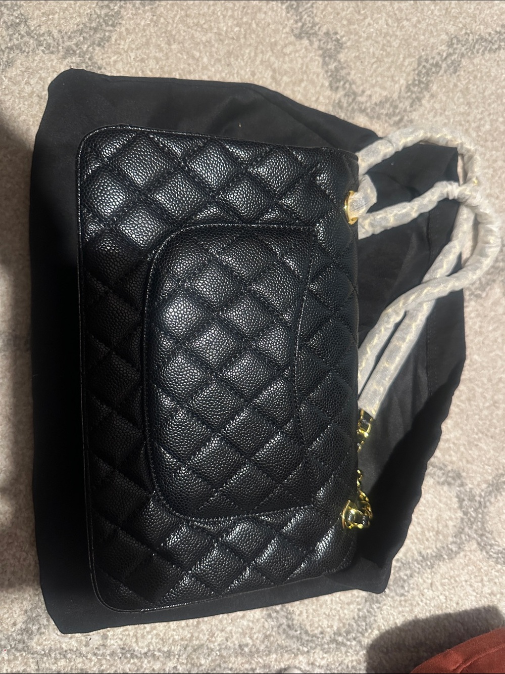 Black quilted flap bag